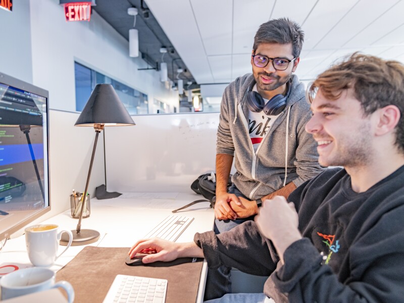 Two Brightspot developers working together