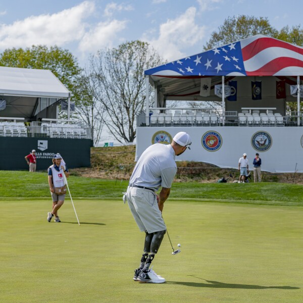 Veteran Jesse Williams attempts to sink a putt during the Wells Fargo Championship Pro-Am